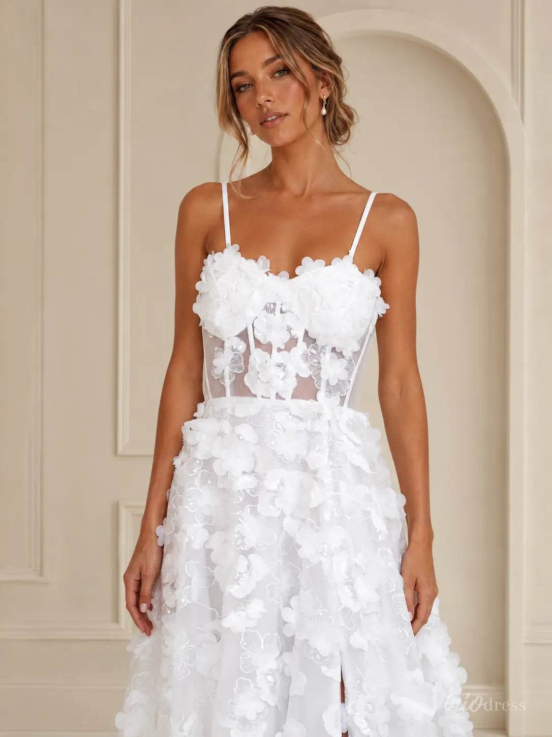 White LA182 wedding dress with a sheer corset bodice, spaghetti straps, and 3D floral lace appliqué details.