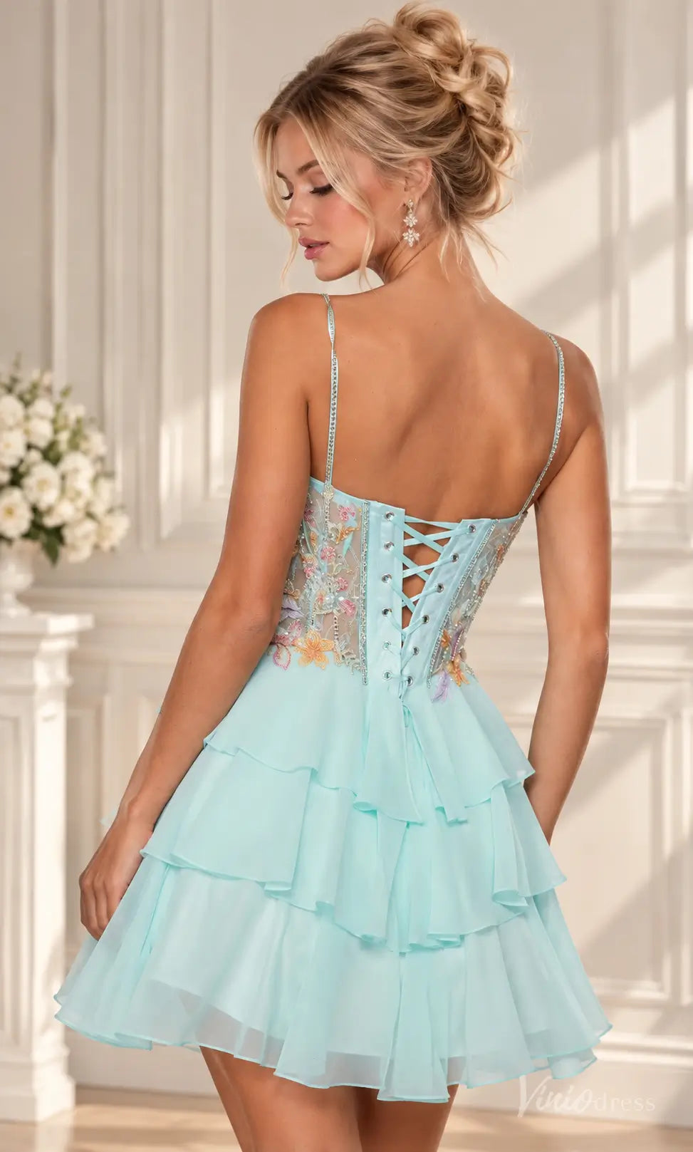 Mint green floral embroidered corset homecoming dress with a tiered ruffle mini skirt and lace-up back.