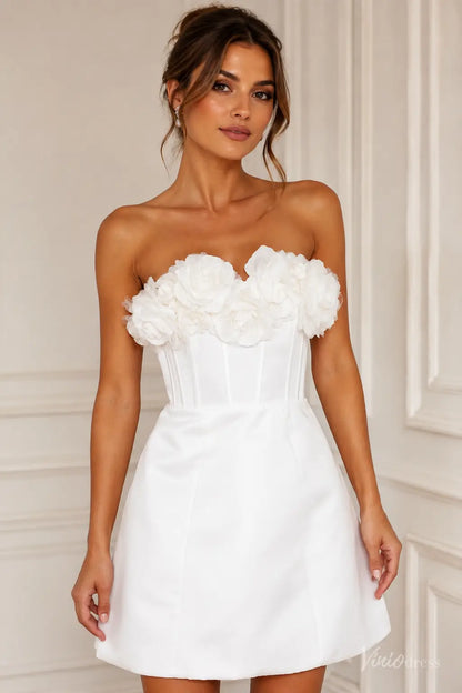 White satin mini wedding dress featuring a strapless corset bodice with handmade 3D floral appliqués.