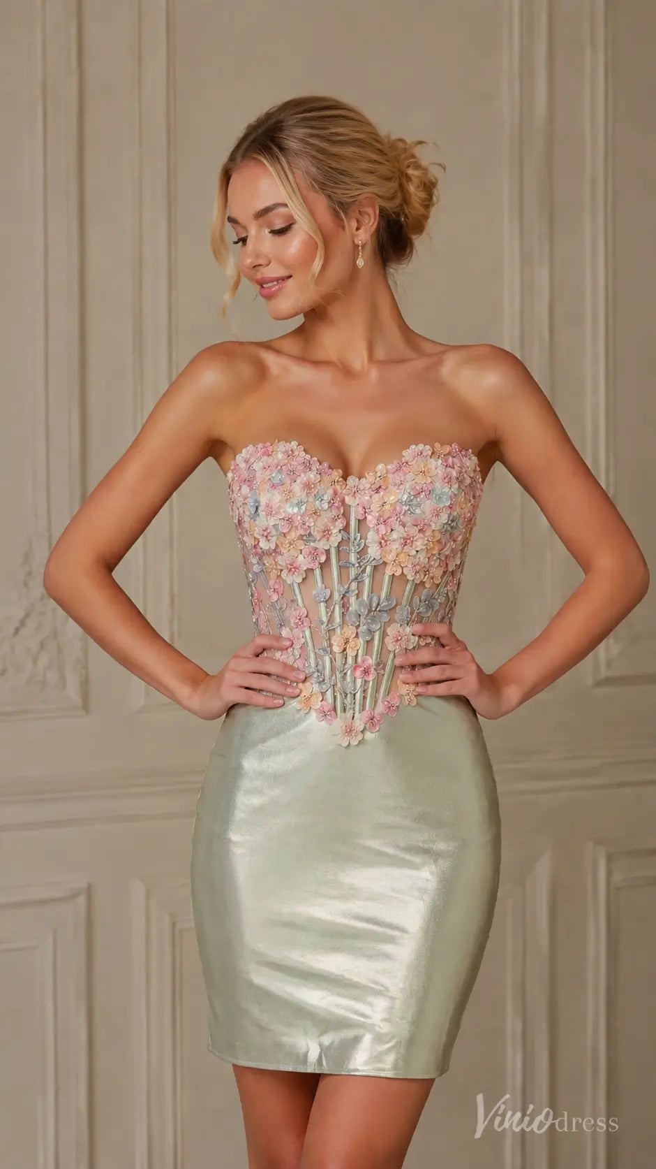 Strapless S26116 mini dress with a floral embroidered corset bodice and a shimmering light green skirt.