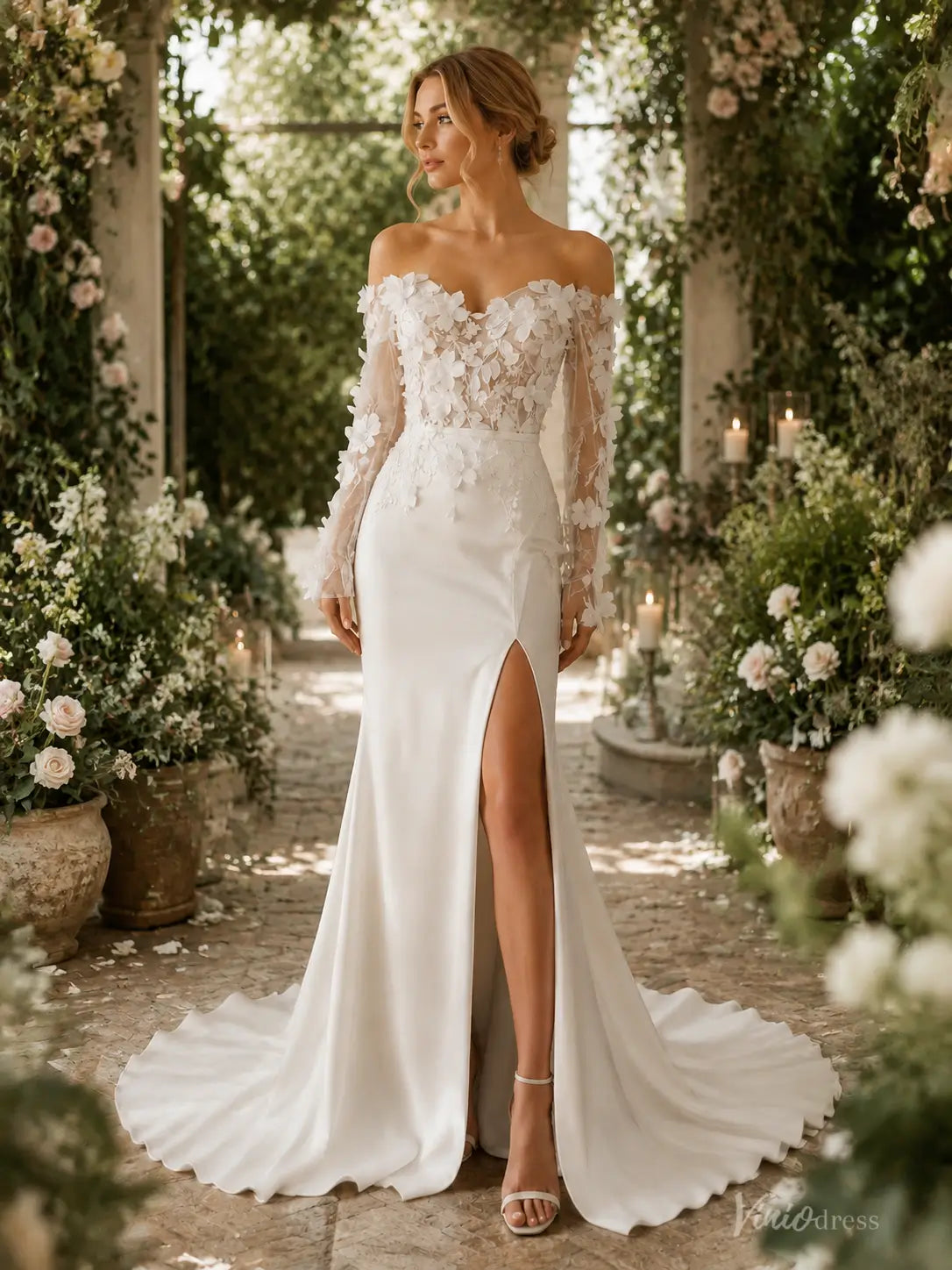 Ivory sheath wedding dress with 3D lace bodice, off-the-shoulder long sleeves, and a high slit in a garden setting.