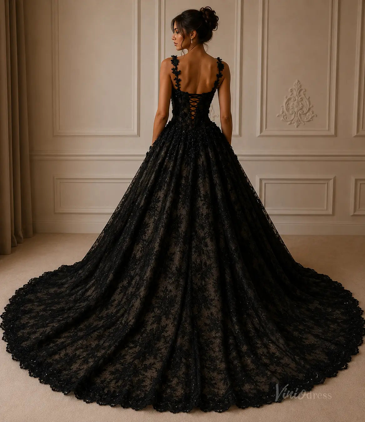 Black lace ball gown with a corset back, floral appliqué straps, and a dramatic floor-length train.