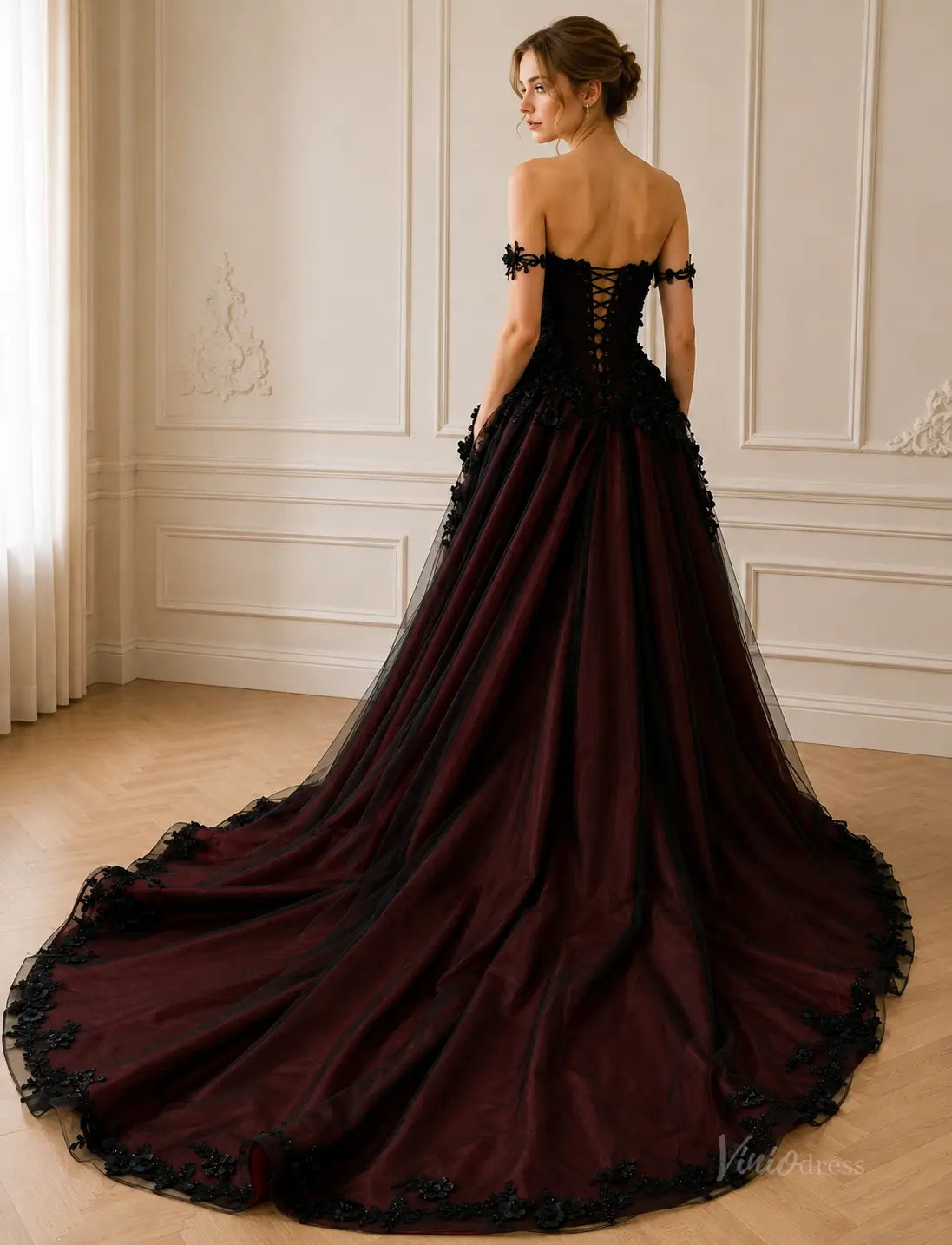 BK135 off-the-shoulder ball gown in dark burgundy tulle with black lace appliqué and a corset-style lace-up back.