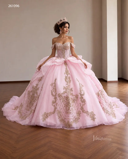 Pink off-shoulder quinceañera ball gown with gold baroque embroidery, crystal corset, and tiered peplum waist.