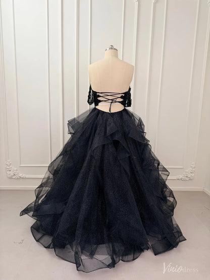 Black glitter tulle ball gown with off-shoulder sleeves, lace bodice, and a voluminous ruffled skirt on a mannequin.