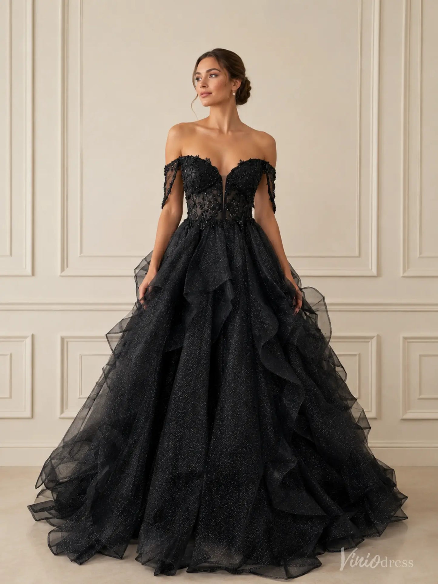 Black glitter ball gown with off-shoulder corset bodice, illusion V-neck, and voluminous ruffled tulle skirt.