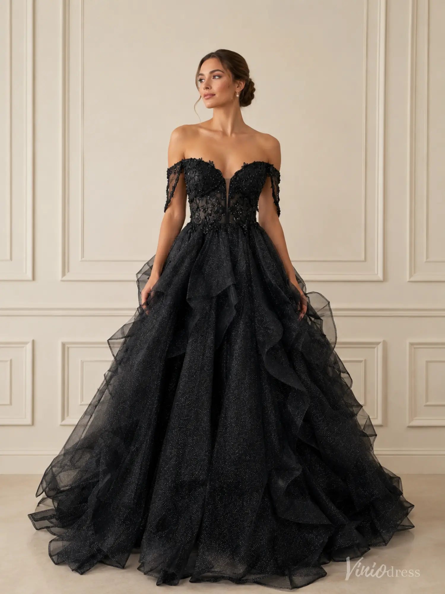 Black glitter ball gown with off-shoulder corset bodice, illusion V-neck, and voluminous ruffled tulle skirt.