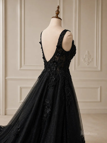 Black glitter tulle A-line wedding dress with a deep V-back, wide straps, and 3D floral appliqué on a mannequin.