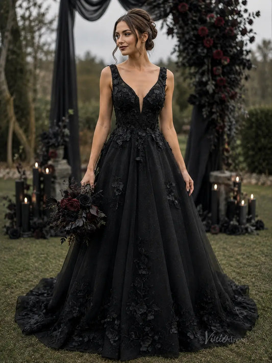 Black A-line wedding dress in glitter tulle with deep V-neck, 3D floral appliqué, and chapel train.