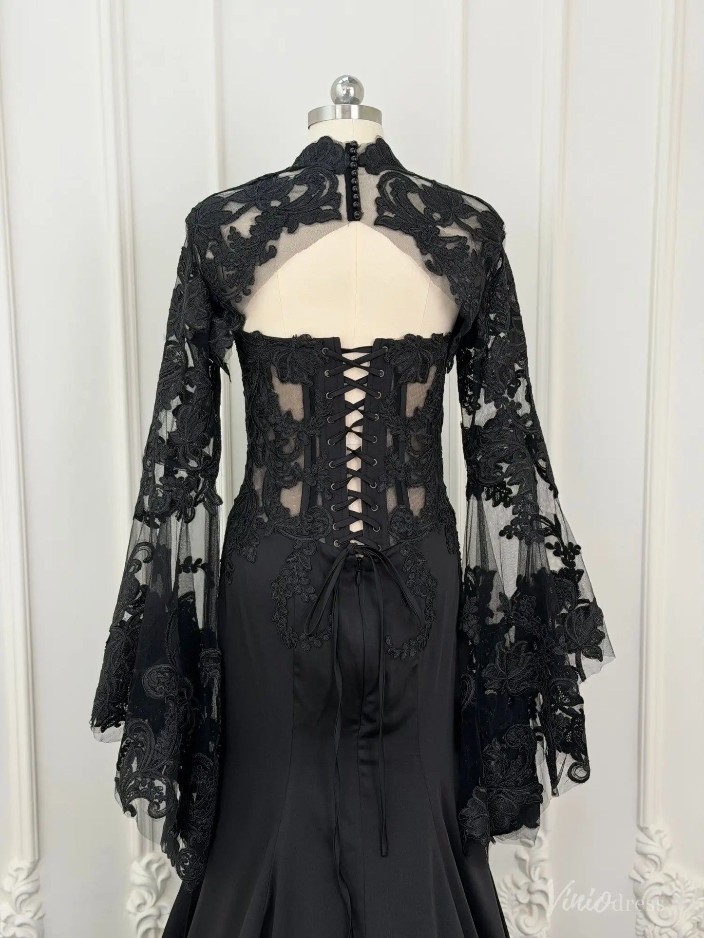Black mermaid wedding dress with lace-up corset back and detachable sheer lace long sleeve overlay.