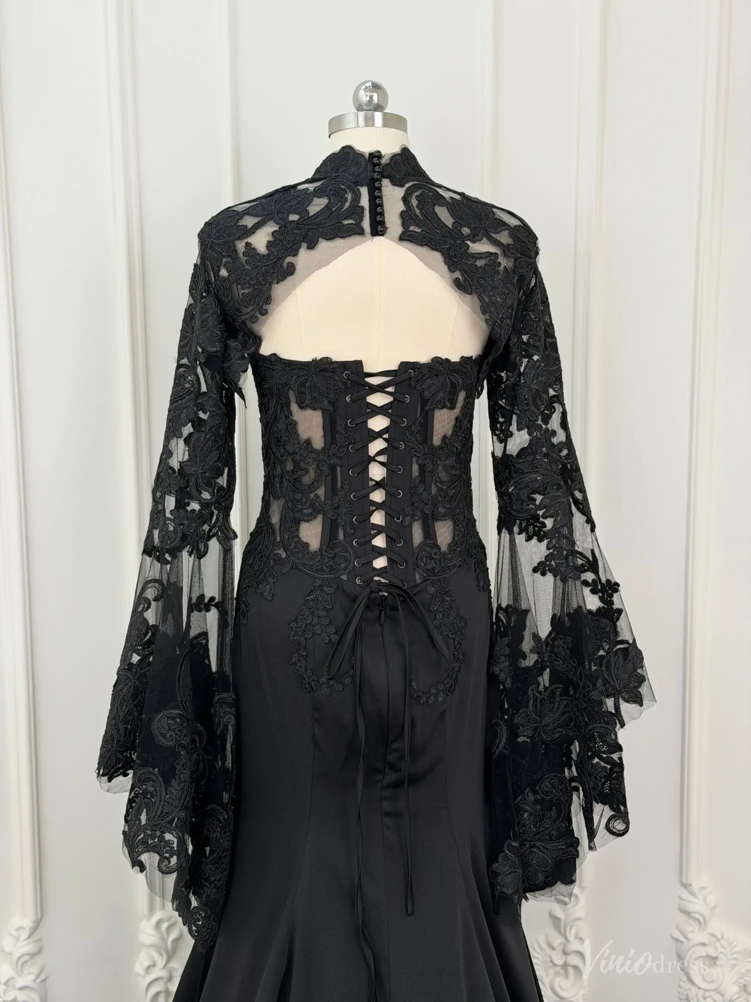 Black mermaid wedding dress with lace-up corset back and detachable sheer lace long sleeve overlay.