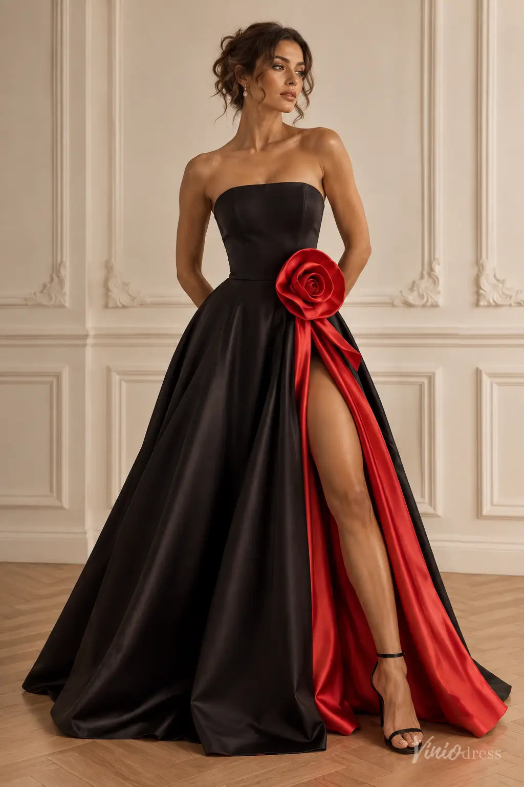 Black and red strapless satin A-line prom dress with a 3D waist rosette and high leg slit.