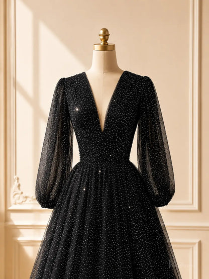 Black glitter tulle prom dress with a deep V-neck, sheer bishop sleeves, and a ruched bodice on a mannequin.