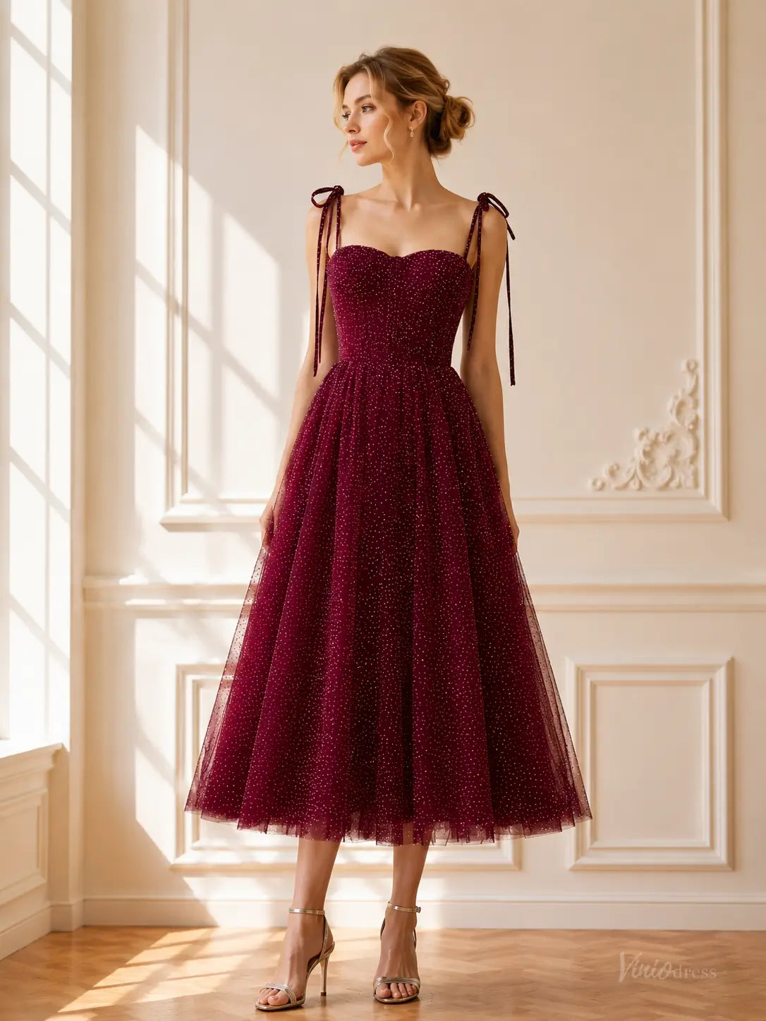 Burgundy tea-length prom dress in glitter tulle with a sweetheart neckline, tie straps, and a full A-line skirt.
