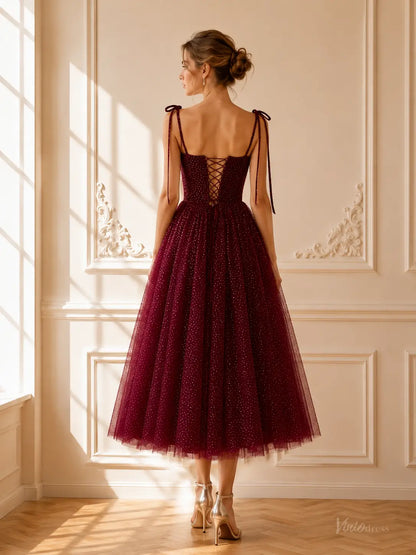 Burgundy tea-length prom dress in glitter tulle with tie straps and a lace-up corset back.