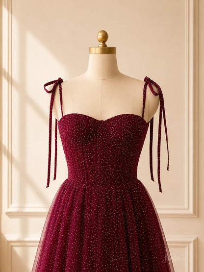 Burgundy tea-length prom dress in glitter tulle with a sweetheart neckline, corset bodice, and tie shoulder straps.