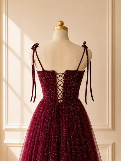 Burgundy glitter tulle tea-length prom dress with tie straps and a lace-up corset back on a mannequin.