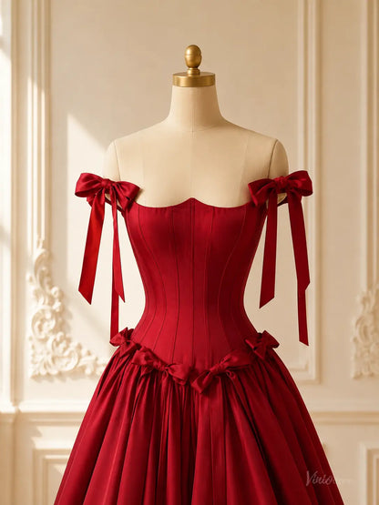 Burgundy satin ball gown with a corset bodice, basque waist, and off-the-shoulder bow straps on a mannequin.