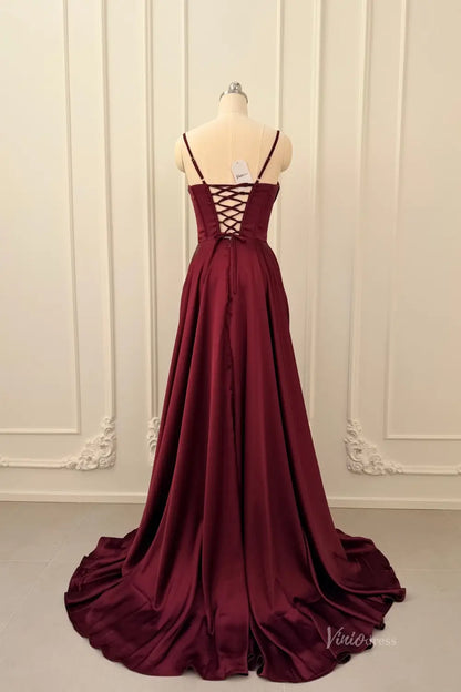 Back view of a burgundy satin prom dress with a lace-up corset back and a flowing floor-length skirt.