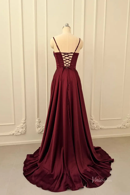 Burgundy satin prom dress with a lace-up corset back and flowing A-line skirt on a mannequin.