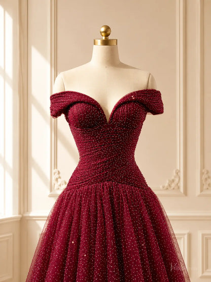 Burgundy sparkly tulle ball gown with an off-shoulder sweetheart neckline and ruched bodice on a dress form.
