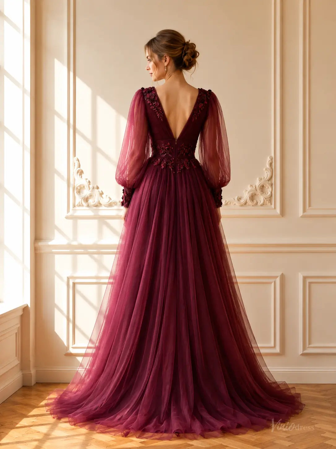 Burgundy tulle A-line prom dress with deep V-back, sheer bishop sleeves, and floral lace appliqués.