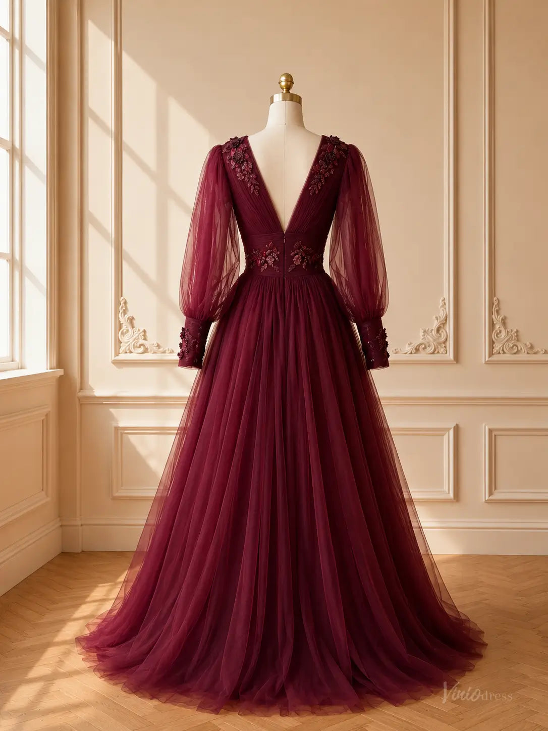 Burgundy tulle A-line prom dress with deep V-back, sheer bishop sleeves, and intricate floral lace appliqués.