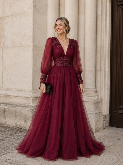 Burgundy tulle A-line prom dress with deep V-neck, sheer bishop sleeves, and floral lace appliqués on the bodice.