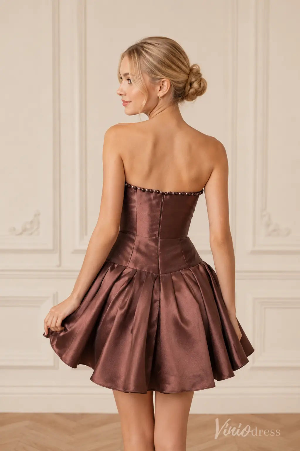 Back view of S26141 brown strapless satin mini dress with beaded trim and flared skirt