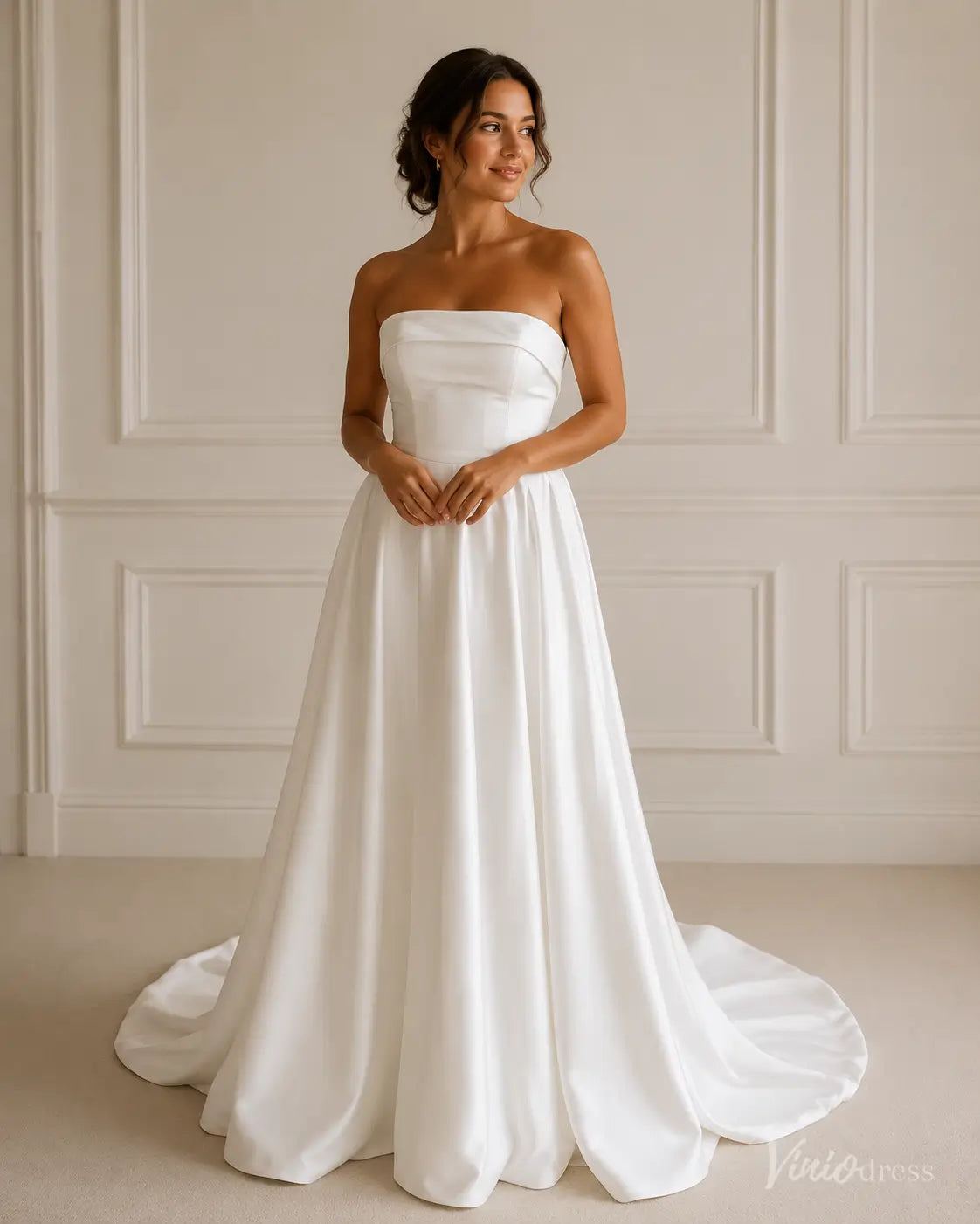 Elegant white satin A-line wedding dress with a strapless bodice and a flowing floor-length skirt with a train.