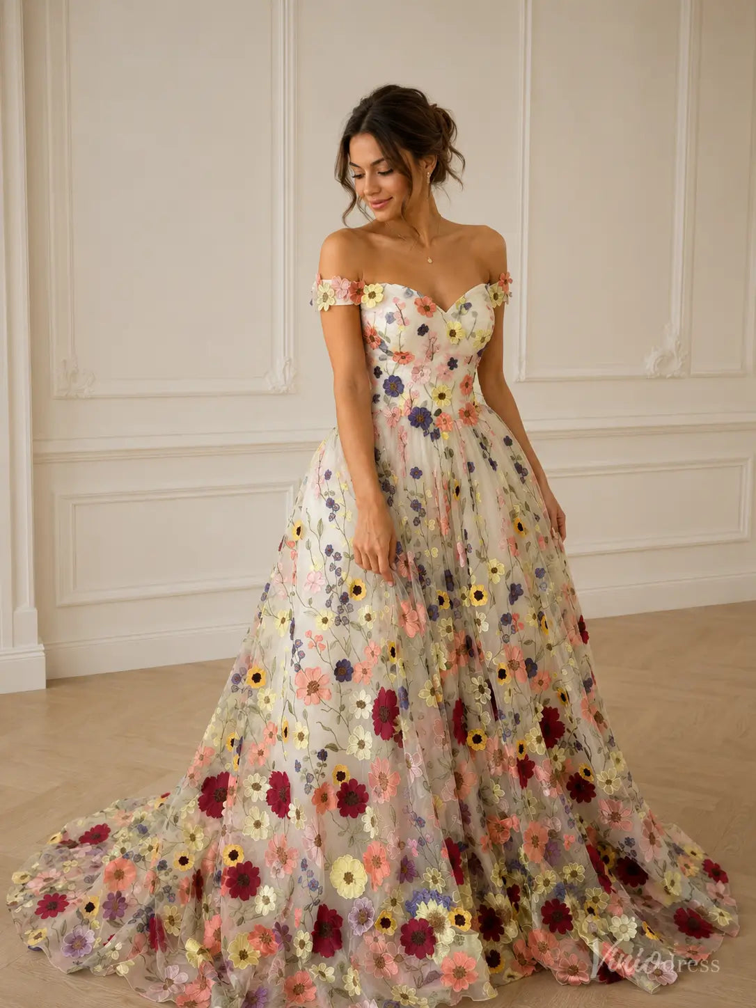 Off-the-shoulder ball gown with multicolor floral embroidery on tulle and a sweetheart neckline.