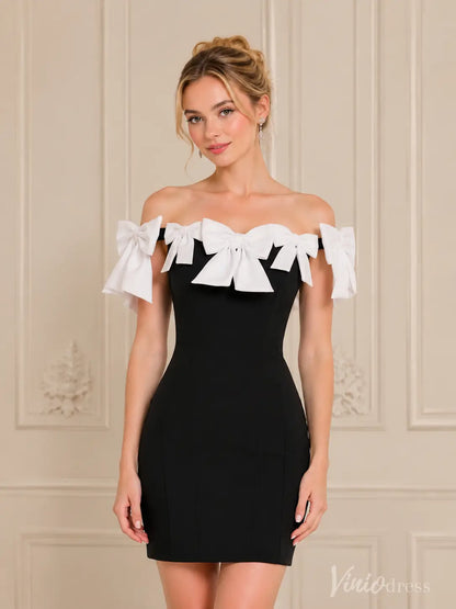 Black off-shoulder mini dress with white bow details on the neckline.