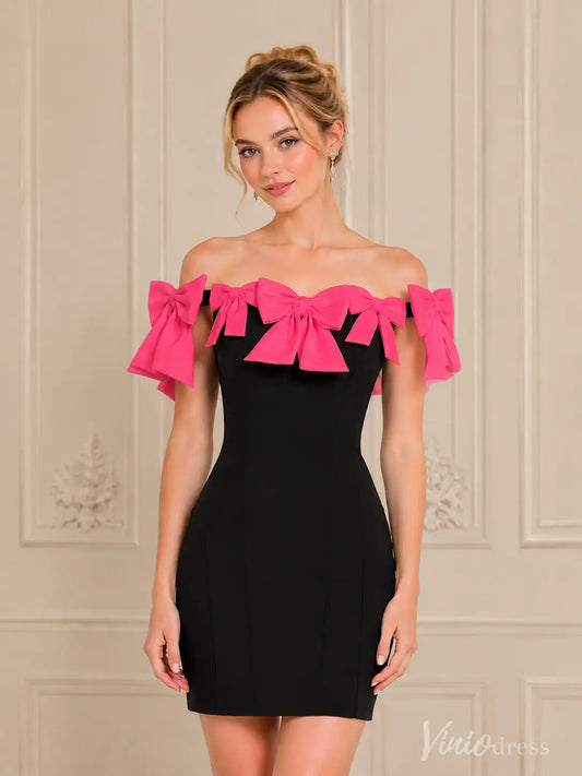 Black off-shoulder mini dress with vibrant pink bow details on the neckline and sleeves.