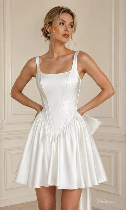 White satin mini wedding dress with a square neckline, corset-style bodice, and a voluminous flared skirt.