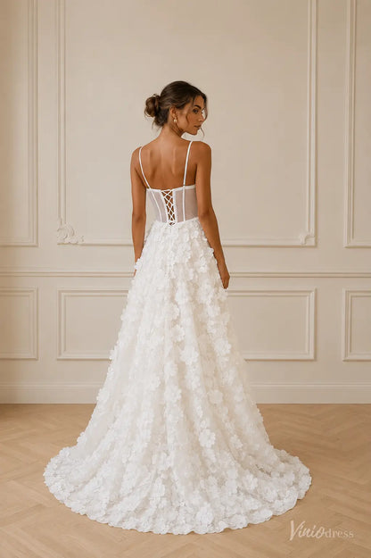 White A-line wedding dress with a corset back, spaghetti straps, and 3D floral lace applique on a full-length skirt.