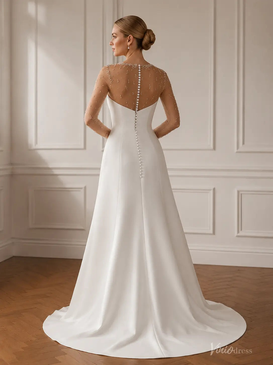 MN174 white A-line wedding dress with a sheer beaded illusion back and a long row of delicate fabric buttons.