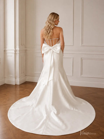 MN175 white satin mermaid wedding dress with a strapless corset bodice, crystal detailing, and a large back bow.