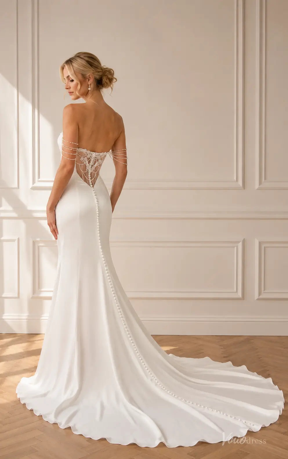 MN178 white satin mermaid wedding dress with an illusion lace back, pearl-draped sleeves, and a long button-down train.