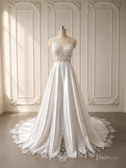 Satin A-line wedding dress with a lace appliqué bodice and cathedral train on a mannequin.