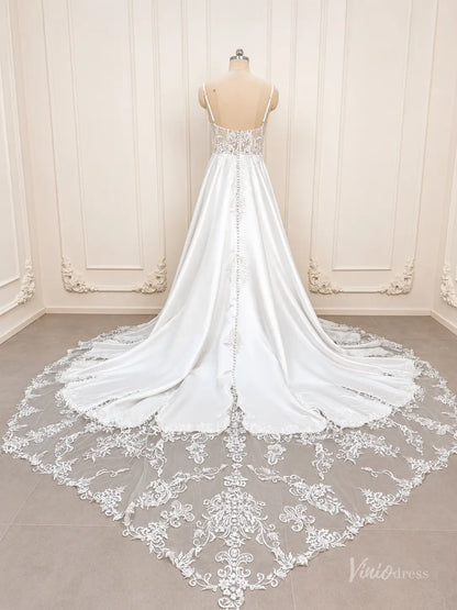 White satin A-line wedding dress with lace bodice, button back, and long lace cathedral train.