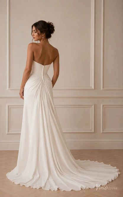 Strapless white chiffon wedding dress with a draped bodice, sweetheart neckline, and a flowing chapel train.