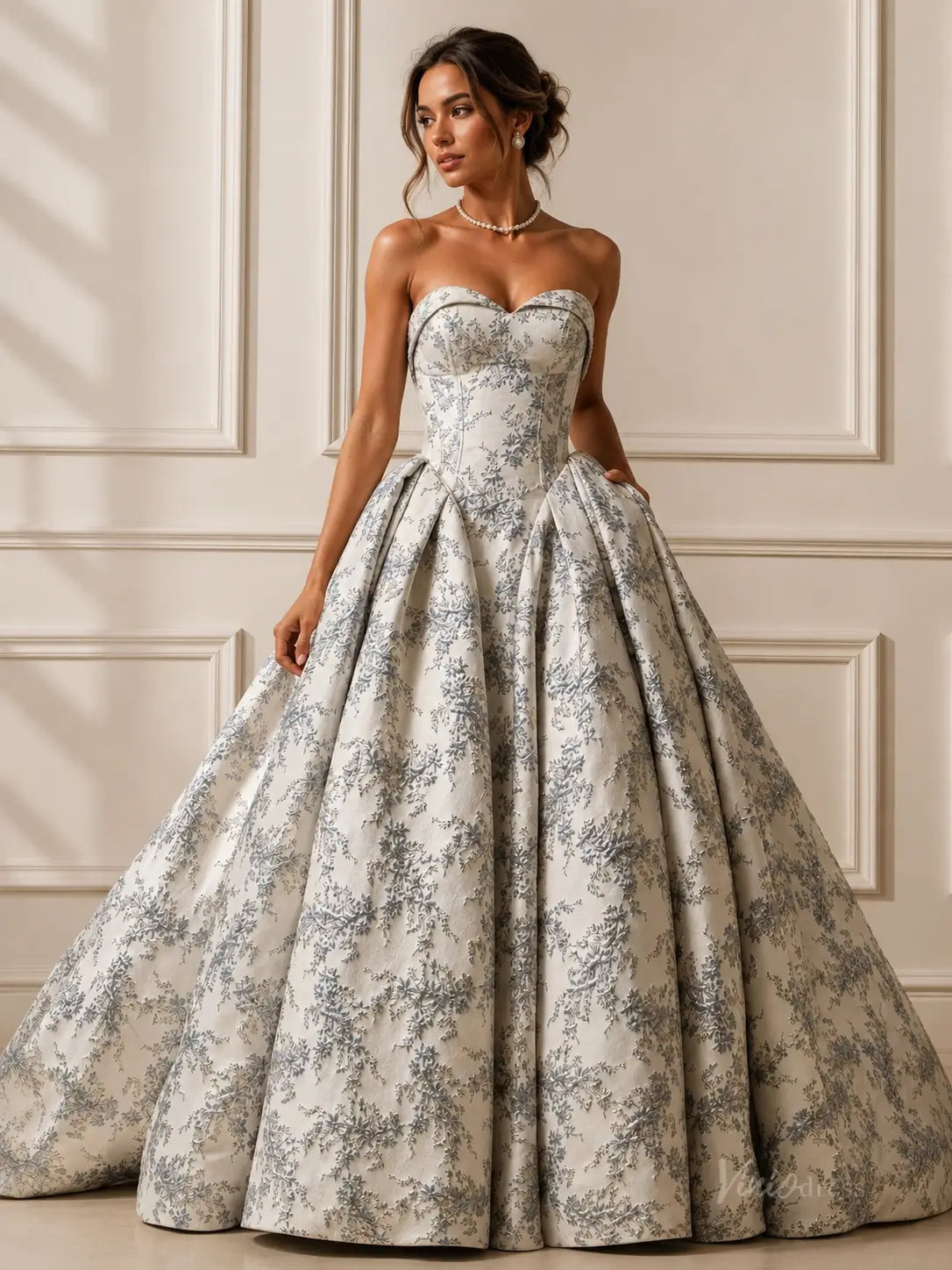 Dusty blue jacquard wedding ball gown with a strapless sweetheart bodice and a full, pleated skirt.
