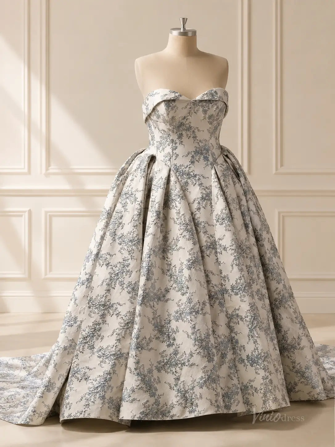 Dusty blue floral jacquard wedding dress with a strapless sweetheart neckline and a voluminous pleated ballgown skirt.