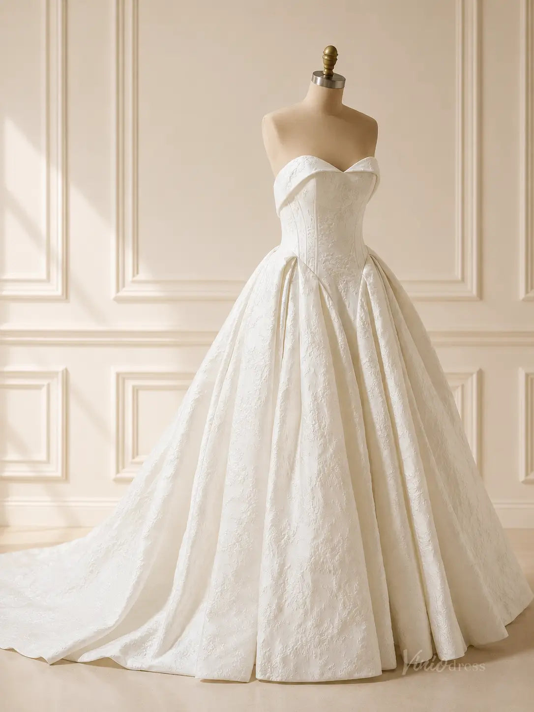 Strapless dusty blue jacquard wedding dress with a sweetheart neckline and a full, pleated ball gown skirt.