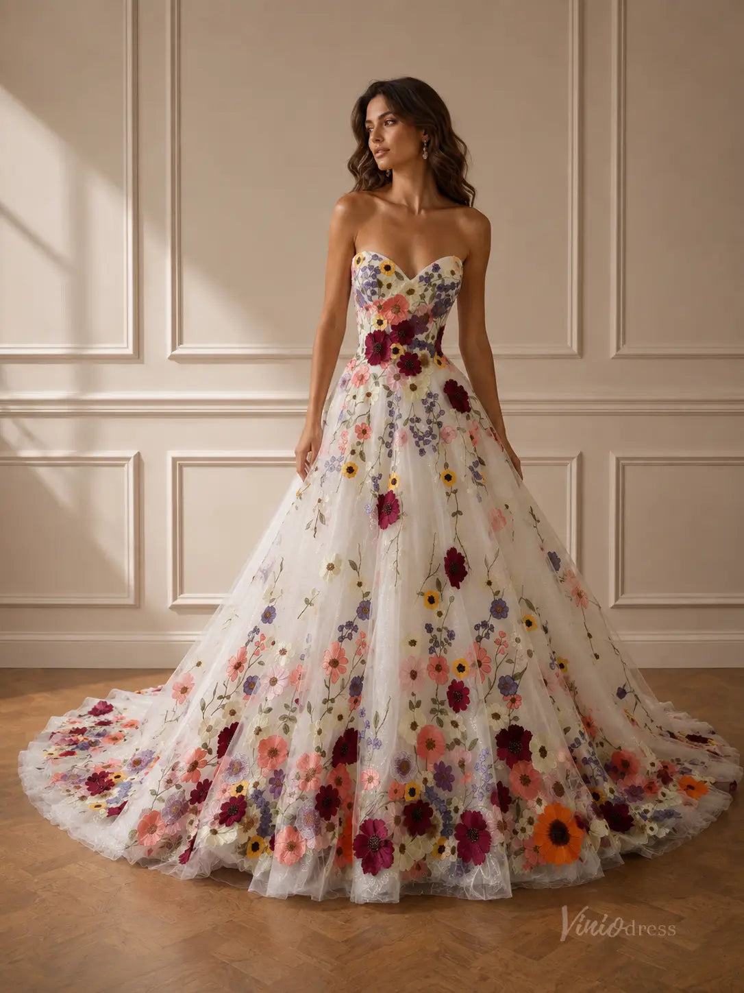 Strapless white ball gown featuring a sweetheart neckline and vibrant, multi-colored 3D floral embroidery throughout.