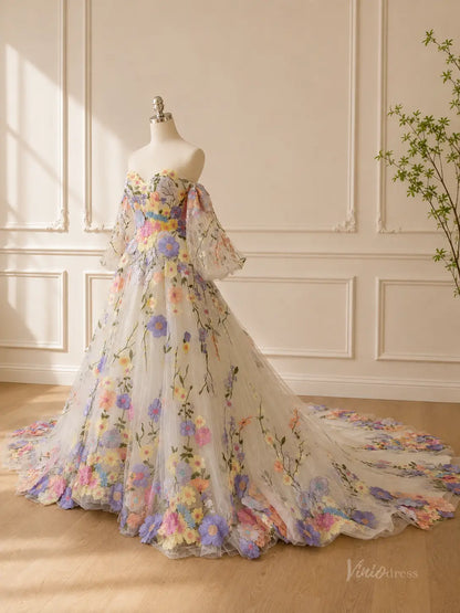 Off-the-shoulder A-line wedding dress featuring colorful 3D floral embroidery, sheer puff sleeves, and a long tulle train.