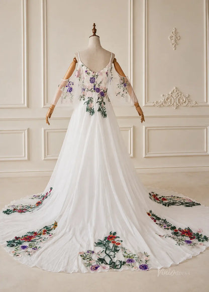 White pleated chiffon wedding dress with floral embroidery, spaghetti straps, and a flowing train on a mannequin.
