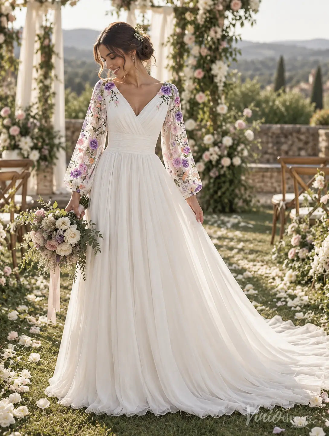 Ivory A-line wedding dress with floral embroidered bishop sleeves, ruched waistband, and flowing chiffon train in a garden.