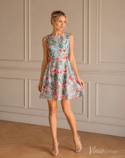Light blue sleeveless A-line mini dress S26148 with pink floral embroidery and silver heels.