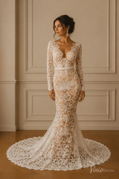 Long-sleeve mermaid wedding dress in white lace with a deep V-neckline and a dramatic floor-length train.